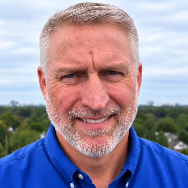 Paul Burgess, head and shoulders, in a blue shirt